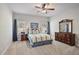 Comfortable bedroom with a ceiling fan, carpet flooring, and natural light at 1622 Bunting Forest Ct, Marietta, GA 30064