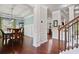 Elegant dining area featuring dark wood floors, decorative wainscoting, and stylish lighting fixtures throughout at 1622 Bunting Forest Ct, Marietta, GA 30064