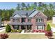 Beautiful two-story brick home with a well-manicured lawn and tasteful landscaping at 1622 Bunting Forest Ct, Marietta, GA 30064