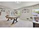 Spacious game room featuring a pool table and foosball table for entertainment at 1622 Bunting Forest Ct, Marietta, GA 30064