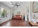 Bright living room with hardwood floors, coffered ceilings, and large windows offering plenty of natural light at 1622 Bunting Forest Ct, Marietta, GA 30064
