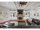 Inviting living room features a stone fireplace, custom built-ins, coffered ceiling and ample natural light at 1622 Bunting Forest Ct, Marietta, GA 30064