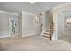 Spacious living room featuring stairs and entry into the Primary suite at 1622 Bunting Forest Ct, Marietta, GA 30064