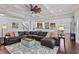 Spacious living room features a ceiling fan, coffered ceiling, and hardwood floors at 1622 Bunting Forest Ct, Marietta, GA 30064