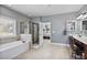 Bathroom featuring a separate shower and soaking tub at 1622 Bunting Forest Ct, Marietta, GA 30064