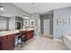 Main bathroom boasting a large vanity and a soaking tub at 1622 Bunting Forest Ct, Marietta, GA 30064