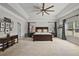 Spacious main bedroom with a large bed, tray ceiling, and ample natural light at 1622 Bunting Forest Ct, Marietta, GA 30064