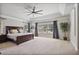 Spacious main bedroom boasts tray ceilings, plush carpet, and a sitting area with natural light at 1622 Bunting Forest Ct, Marietta, GA 30064