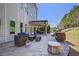 Inviting patio with comfortable seating, a grill, and views of the landscaped backyard at 1622 Bunting Forest Ct, Marietta, GA 30064