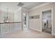 Upstairs landing leading to the laundry room, staircase, and bedrooms at 1622 Bunting Forest Ct, Marietta, GA 30064
