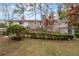 Well-maintained backyard with lush grass, manicured shrubs, and a patio area, perfect for outdoor entertaining at 2000 Hill Rd, Marietta, GA 30062