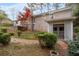 Picturesque backyard with brick accents, lush greenery, and a charming outdoor structure at 2000 Hill Rd, Marietta, GA 30062