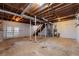 Unfinished basement with exposed ceiling, full walkout, and staircase to upper level at 2000 Hill Rd, Marietta, GA 30062
