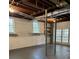 Spacious basement features large windows and double doors leading to the outside, offering natural light at 2000 Hill Rd, Marietta, GA 30062