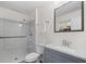 Clean bathroom features tiled shower, and modern vanity with granite countertop at 2000 Hill Rd, Marietta, GA 30062