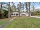 Charming ranch-style home with a welcoming front porch and well-maintained lawn, creating inviting curb appeal at 2000 Hill Rd, Marietta, GA 30062