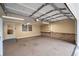 Spacious garage features an automatic door, storage shelving, and room for two cars at 2000 Hill Rd, Marietta, GA 30062