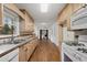 Well-lit kitchen featuring wood cabinets, ample counter space, and modern appliances with backyard views at 2000 Hill Rd, Marietta, GA 30062