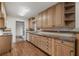 Traditional kitchen featuring wood cabinetry, stainless steel appliances, and durable vinyl flooring at 2000 Hill Rd, Marietta, GA 30062