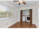 Well-lit laundry area equipped with a washer, dryer, storage cabinets, and outside views at 2000 Hill Rd, Marietta, GA 30062