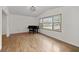 Bright and open living room featuring gleaming hardwood floors and a large window, perfect for entertaining at 2000 Hill Rd, Marietta, GA 30062