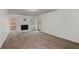 Spacious living room with a white brick fireplace, neutral carpet, and french doors leading to the outside at 2000 Hill Rd, Marietta, GA 30062