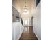Staircase and tall entryway with a view of a hanging chandelier and the front door at 2328 New Haven Pl, Conyers, GA 30094