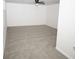 Neutral living room featuring new carpet, fresh paint, a ceiling fan, and electrical outlet at 2328 New Haven Pl, Conyers, GA 30094