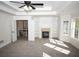 Spacious living room with a fireplace and built-in shelving at 2328 New Haven Pl, Conyers, GA 30094