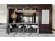 Stylish bar area with modern stools, sleek countertops, and views of the community at 400 W Peachtree Nw St # 3114, Atlanta, GA 30308