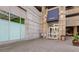 Exterior shot of building entrance with concrete facade and glass doors at 400 W Peachtree Nw St # 3114, Atlanta, GA 30308