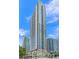 Tall high-rise building with glass windows and balconies against blue sky at 400 W Peachtree Nw St # 3114, Atlanta, GA 30308