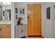Apartment entryway with wood flooring, storage cabinet, and access to the bathroom at 400 W Peachtree Nw St # 3114, Atlanta, GA 30308