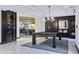 Entertainment room with pool table, stylish lighting, dart board and view into theater at 400 W Peachtree Nw St # 3114, Atlanta, GA 30308