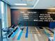 Bright gym with modern equipment, inspirational wall art, and rubber flooring at 400 W Peachtree Nw St # 3114, Atlanta, GA 30308