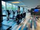 Modern gym with exercise equipment, large windows, and contemporary flooring at 400 W Peachtree Nw St # 3114, Atlanta, GA 30308