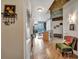 Inviting hallway leads to an open-concept living space with hardwood floors and modern design at 400 W Peachtree Nw St # 3114, Atlanta, GA 30308