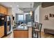 Modern kitchen with stainless appliances, granite counters, and a breakfast bar overlooking city views at 400 W Peachtree Nw St # 3114, Atlanta, GA 30308