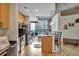 Bright kitchen with breakfast bar, hardwood floors, and views to the outdoor balcony at 400 W Peachtree Nw St # 3114, Atlanta, GA 30308
