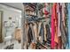Walk-in closet with shelving, hanging racks, and easy access to bathroom and belongings at 400 W Peachtree Nw St # 3114, Atlanta, GA 30308
