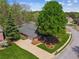 Aerial view of a brick home with large front and back yards, mature trees and circle driveway at 6382 Mountain Ridge Cir, Sugar Hill, GA 30518