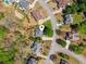 An aerial view shows this home's proximity to a desirable neighborhood and mature trees at 6382 Mountain Ridge Cir, Sugar Hill, GA 30518