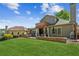 Well manicured lawn and stone retaining walls create a peaceful backyard retreat at 6382 Mountain Ridge Cir, Sugar Hill, GA 30518