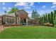 This lush green backyard is bordered by mature trees and beautiful landscaping at 6382 Mountain Ridge Cir, Sugar Hill, GA 30518