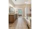 Spacious bathroom with double sink vanity, soaking tub and doorway to the main bedroom at 6382 Mountain Ridge Cir, Sugar Hill, GA 30518