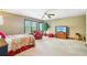 Spacious bedroom with plenty of room to entertain, filled with light from the windows at 6382 Mountain Ridge Cir, Sugar Hill, GA 30518