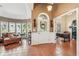 Inviting foyer with tile flooring, decorative front door, and adjacent office space at 6382 Mountain Ridge Cir, Sugar Hill, GA 30518