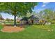 Charming single-story brick home with a well-manicured lawn and mature landscaping at 6382 Mountain Ridge Cir, Sugar Hill, GA 30518