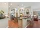 A well-lit kitchen featuring stainless steel appliances, a kitchen island, and sleek granite countertops at 6382 Mountain Ridge Cir, Sugar Hill, GA 30518