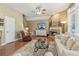 Inviting living room featuring fireplace, tile floor, and plenty of natural light at 6382 Mountain Ridge Cir, Sugar Hill, GA 30518